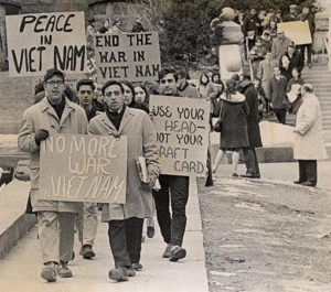 Antiwar protesters in January 1965, uwdigitalcollections - Student protesters marching down Langdon Street, CC BY 2.0